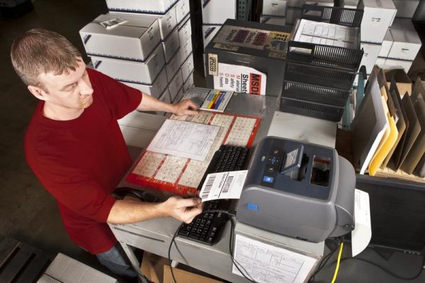 PC43T desktop printer being used in a plastic injection molding facility